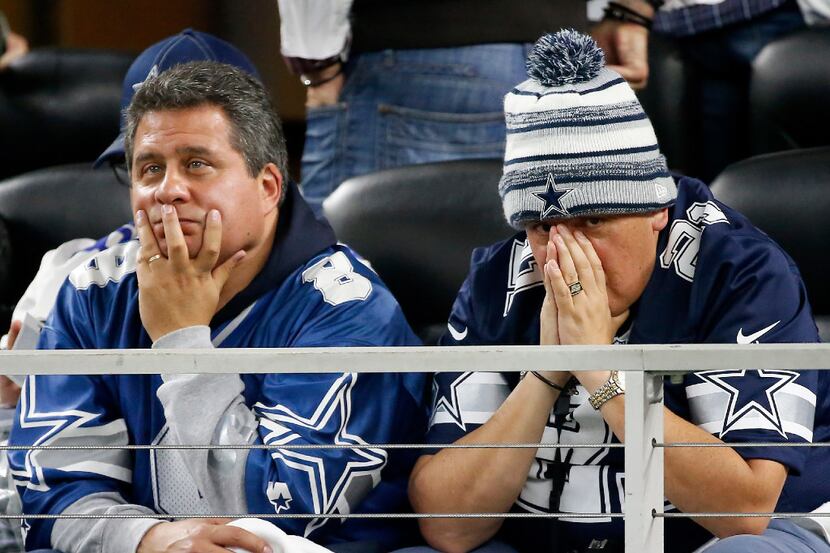 Cowboys fans Miguel Zaldivar (left) and Efra Avila, who traveled from Mexico to watch the...