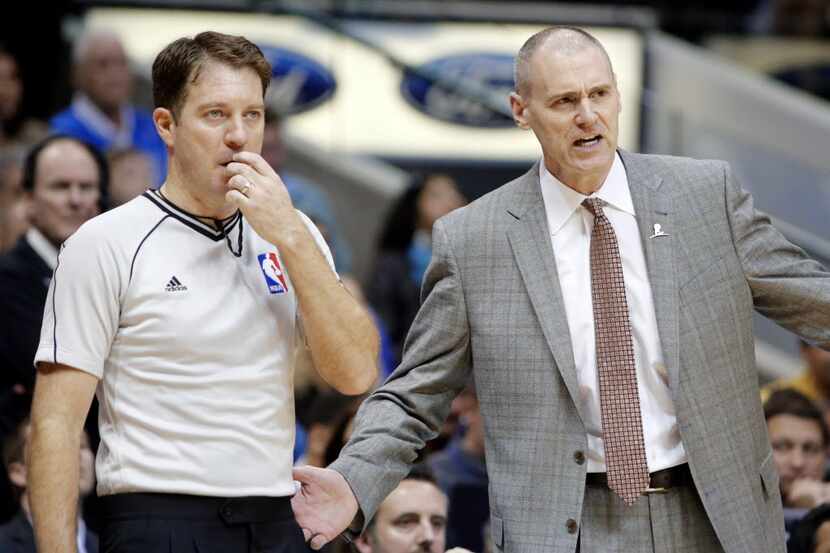 Dallas Mavericks Rick Carlisle (right) argues with an official during the second half of a...