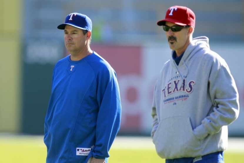 Texas Rangers bullpen coach Andy Hawkins, left, special assistant Greg Maddux and pitching...