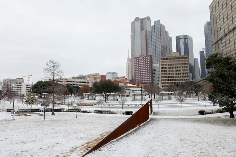 Snow covers the ground at Carpenter Park in downtown Dallas, Monday, Jan. 15, 2024....