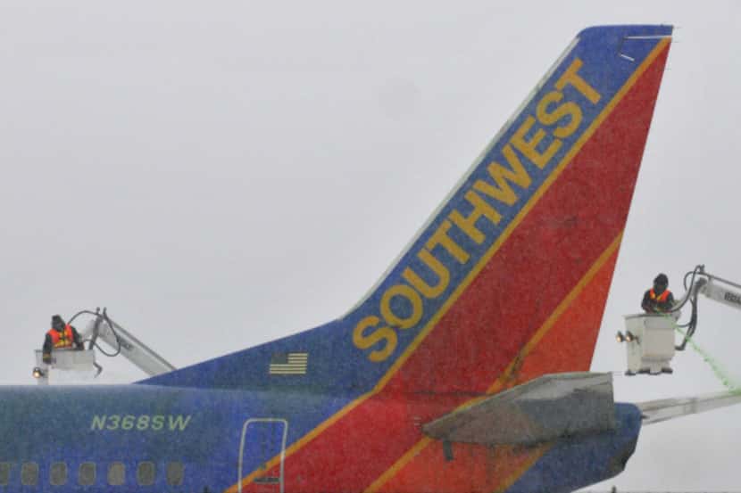 Crews work on de-icing a Southwest Airlines jet at Albany International Airport in New York.