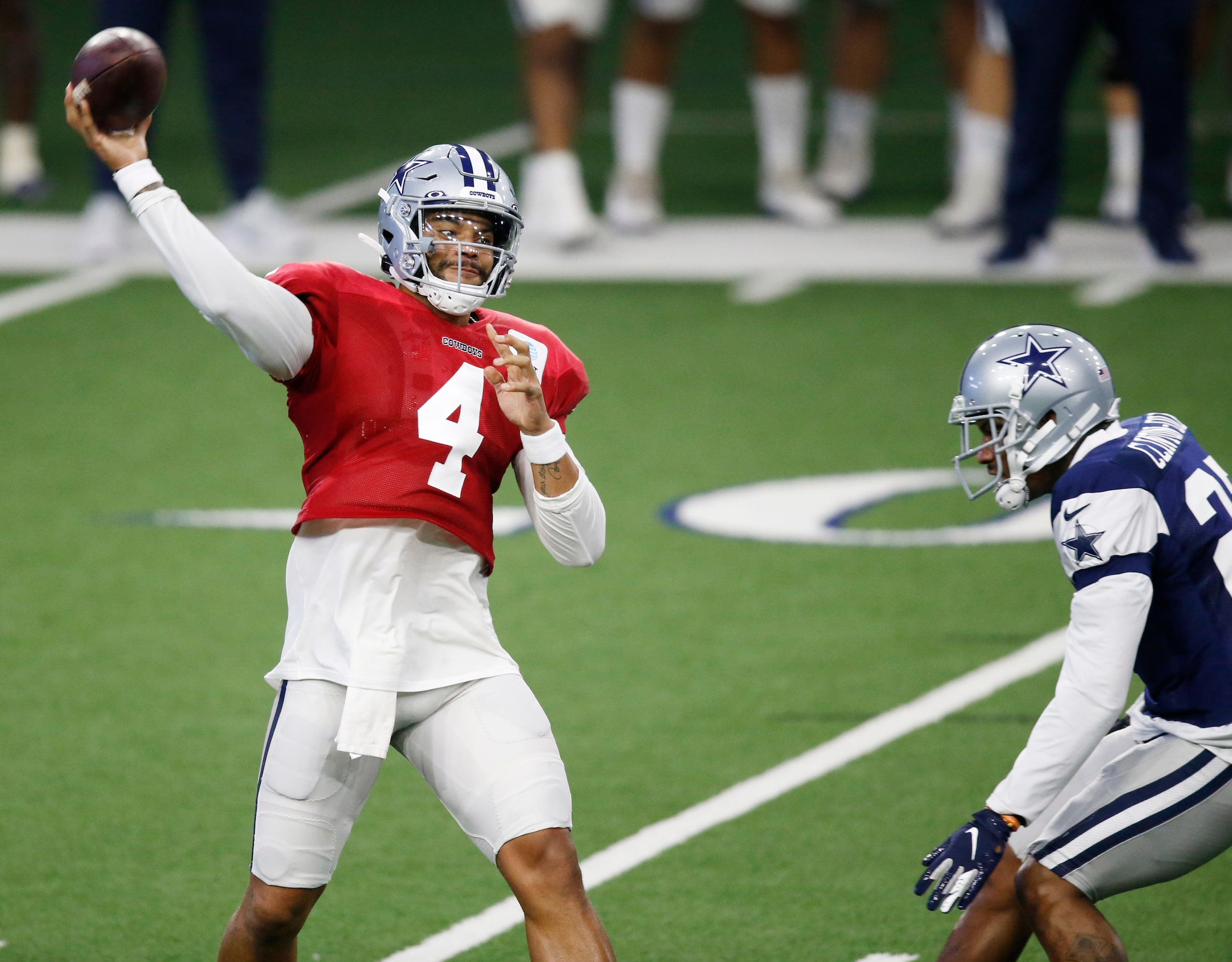 Dallas Cowboys quarterback Dak Prescott (4) attempts a pass as Dallas Cowboys safety Ha Ha...