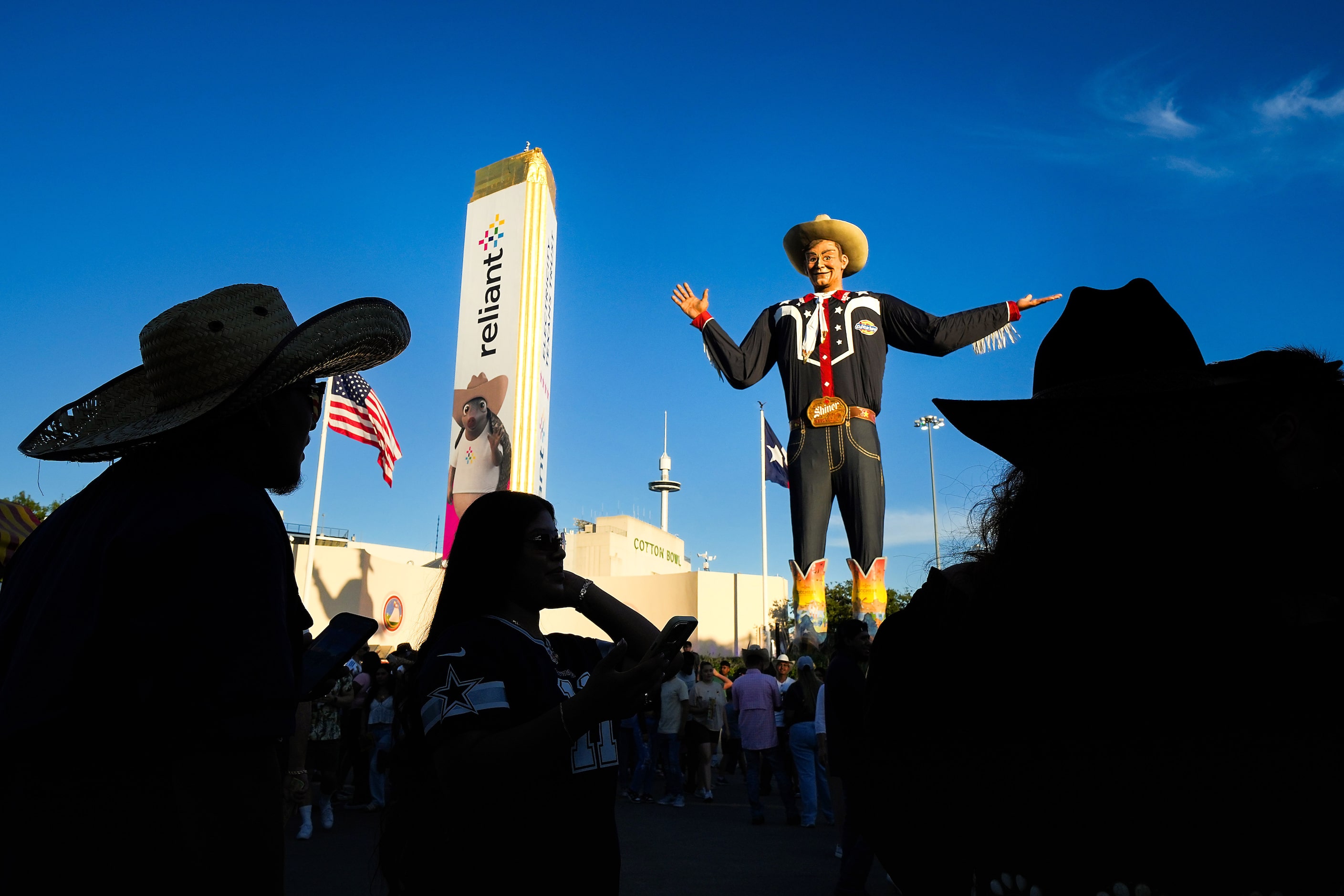 Fairgoers gather at Big Tex Circle at the State Fair of Texas on Sunday, Sept. 29, 2024, in...