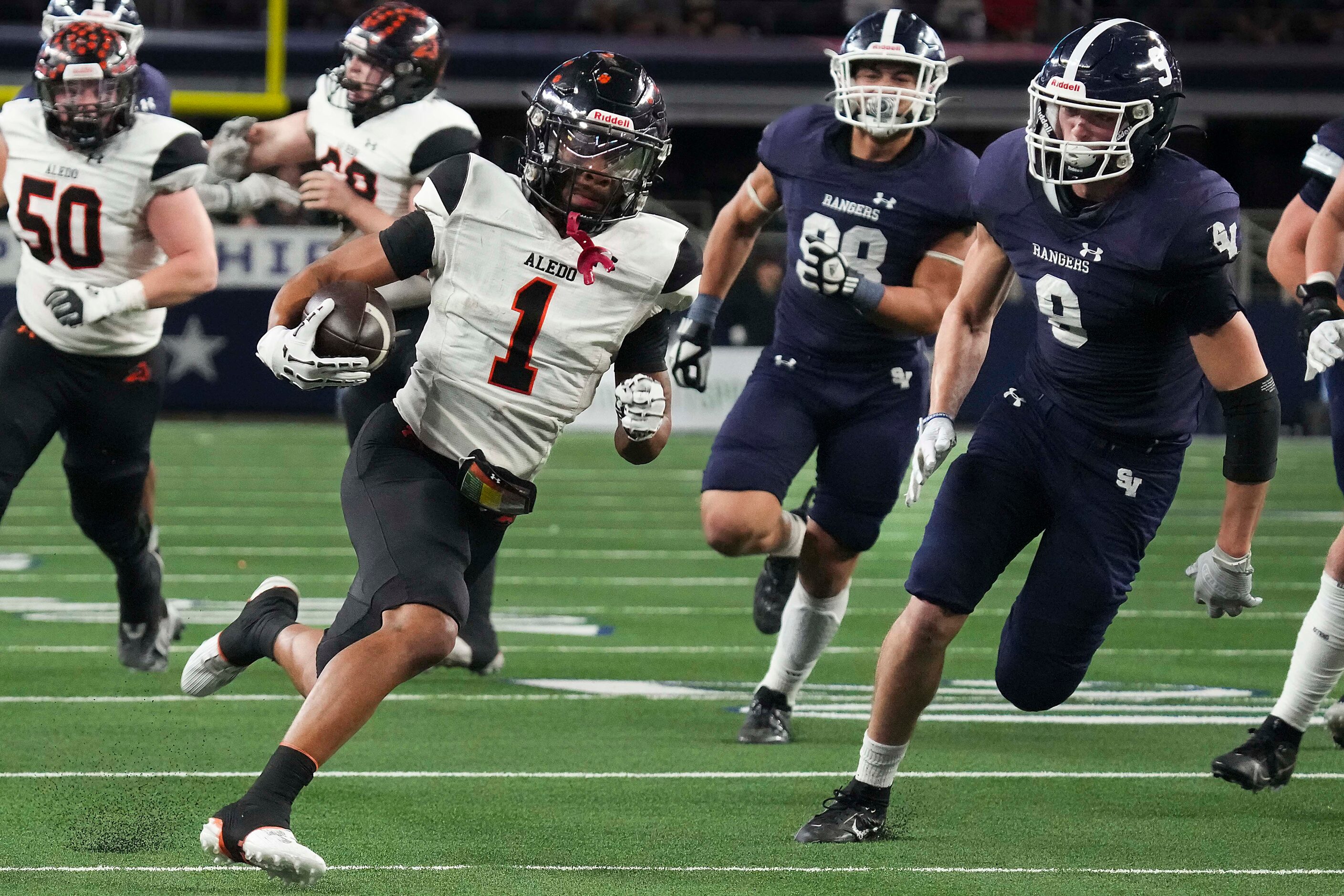 Aledo's Hawk Patrick-Daniels (1) breaks through the Comal Smithson Valley defense on a...