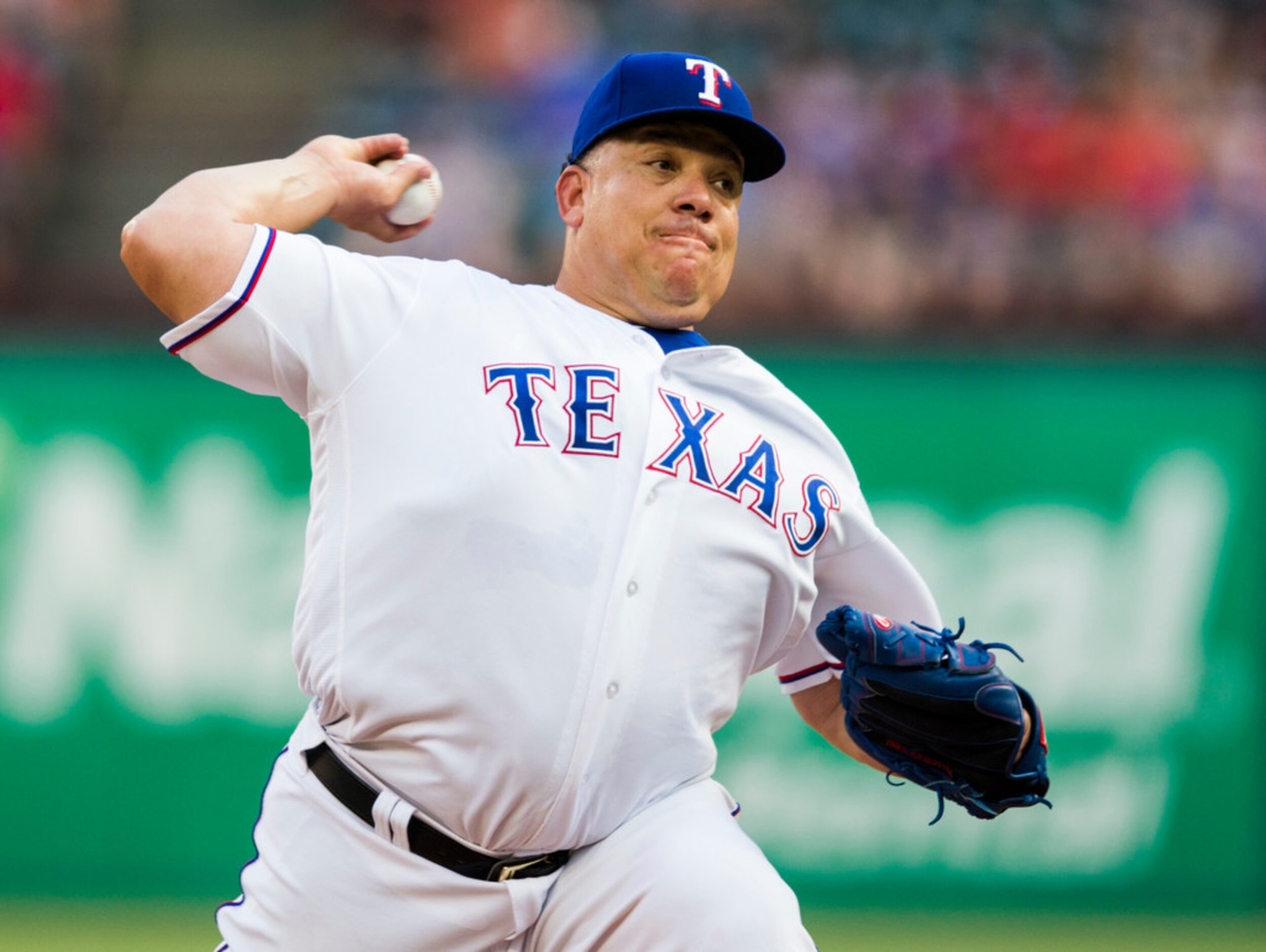 Texas Rangers starting pitcher Bartolo Colon (40) pitches during the first inning of an MLB...