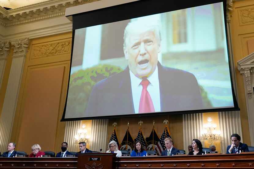 FILE - A video of President Donald Trump is shown on a screen, as the House select committee...