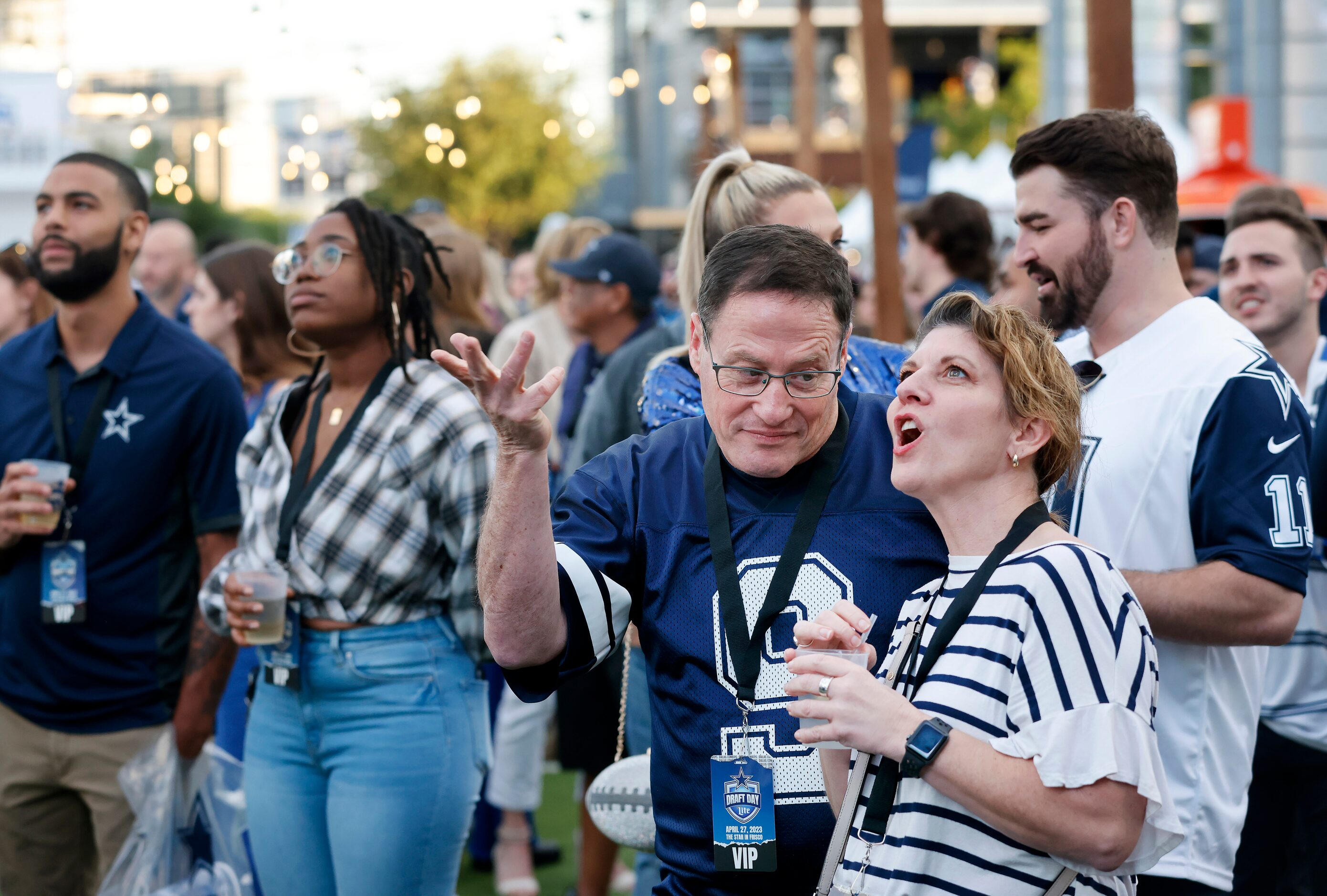 Dallas Cowboys fans Ido Mazor of Allen (center, left) and his friend Patsy Helmick of Fort...