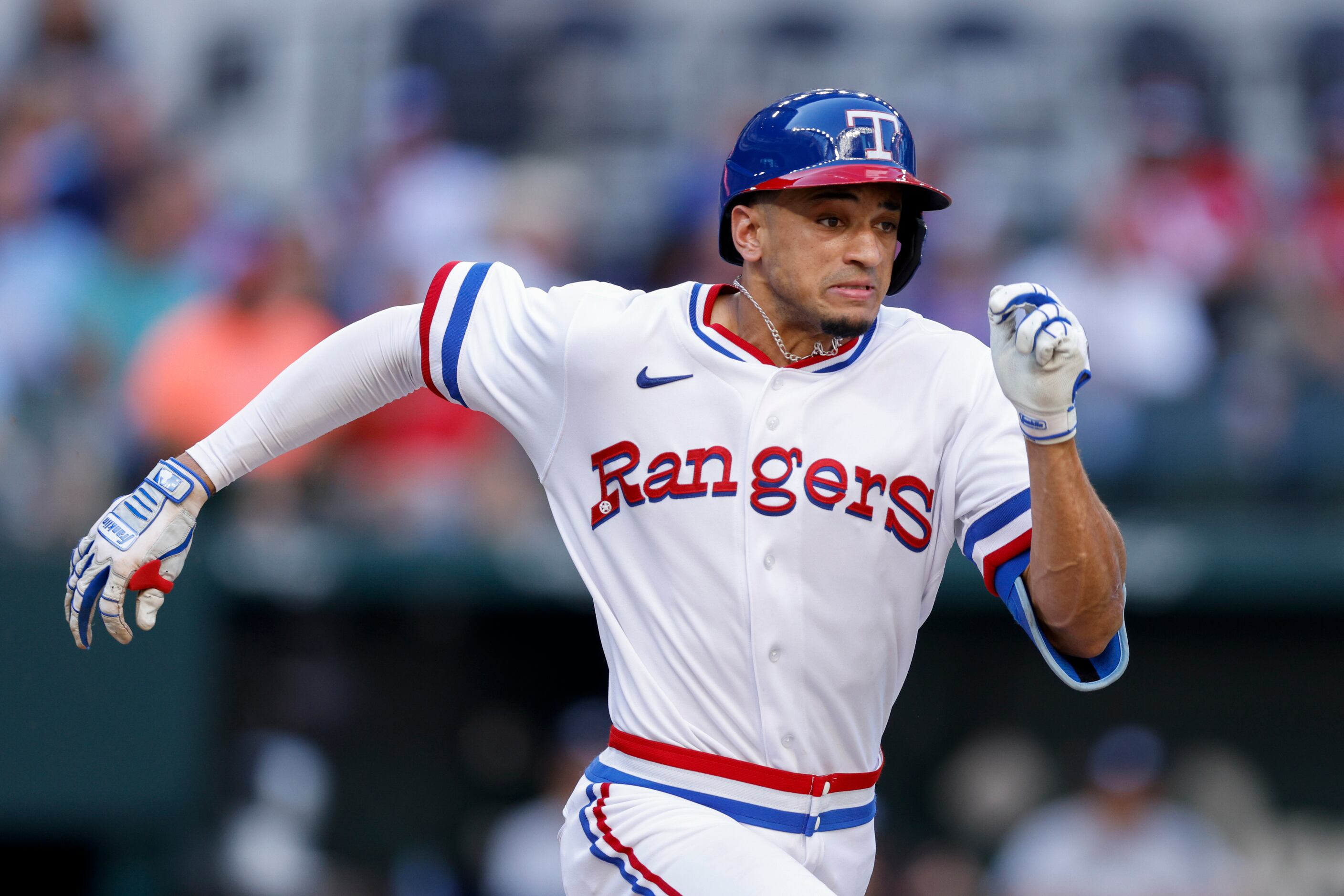 Texas Rangers right fielder Bubba Thompson (65) sprints to first base for an infield single...