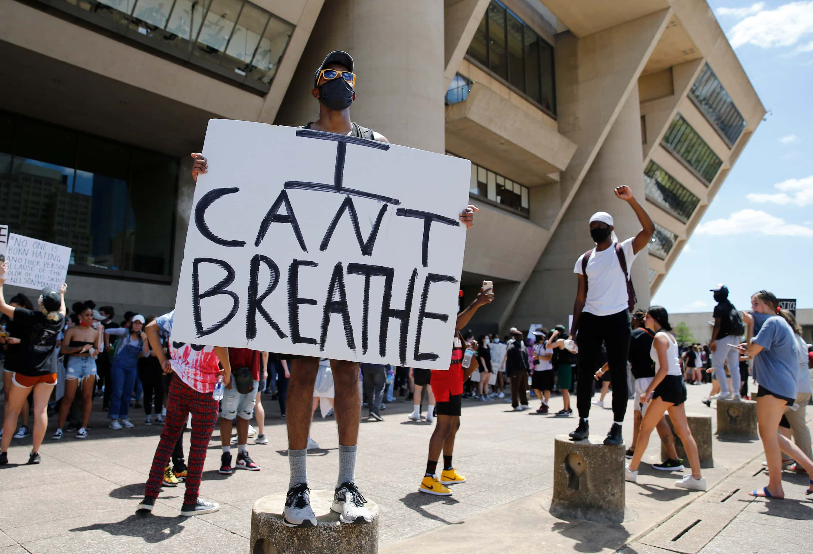 Protesters rally during a demonstration against police brutality in downtown Dallas, on...