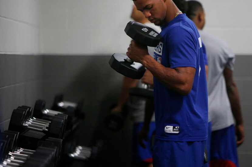 Texas Rangers minor league player Leody Taveras lifts weights during training at Arlington...