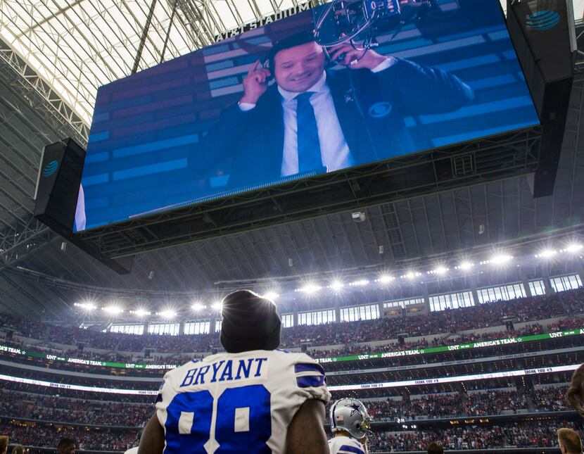 Dallas Cowboys wide receiver Dez Bryant (88) watches as a tribute to broadcaster and former...