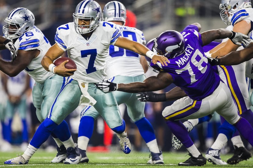 Dallas Cowboys quarterback Jameill Showers (7) is sacked by Minnesota Vikings guard Stephen...
