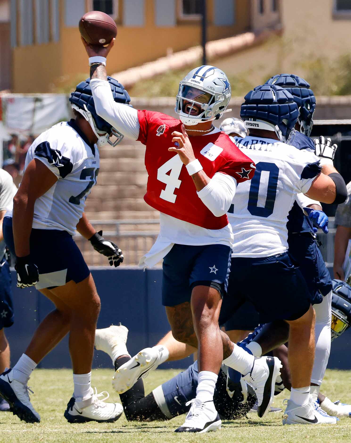 Dallas Cowboys quarterback Dak Prescott (4) fires a pass during a training camp practice in...