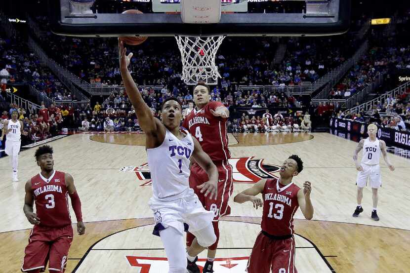 TCU's Desmond Bane (1) gets past Oklahoma's Jamuni McNeace (4) to put up a shot during the...