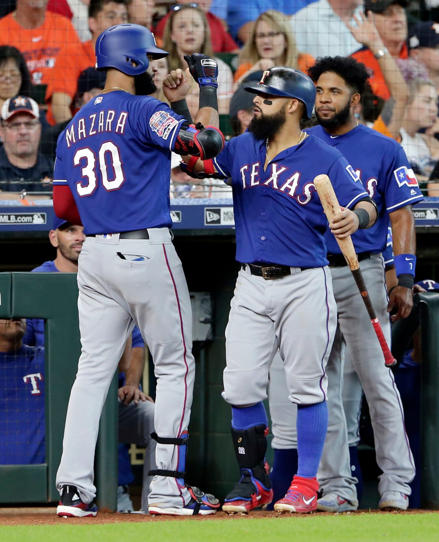 Texas Rangers Nomar Mazara, left, gets congrats from Rougned Odor, middle, and Elvis Andrus,...