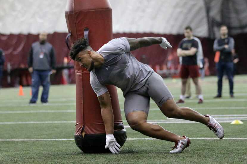 Boston College defensive end Harold Landry performs football field drills during BC Pro Day,...