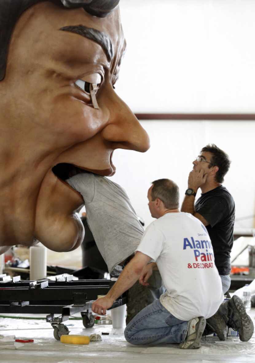 SRO scenic artist Mike Lindon poked his head into Big Tex's mouth on Sept. 9 to make some...