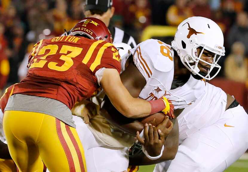 AMES, IA â OCTOBER 31: Defensive back Darian Cotton #23 of the Iowa State Cyclones tackles...