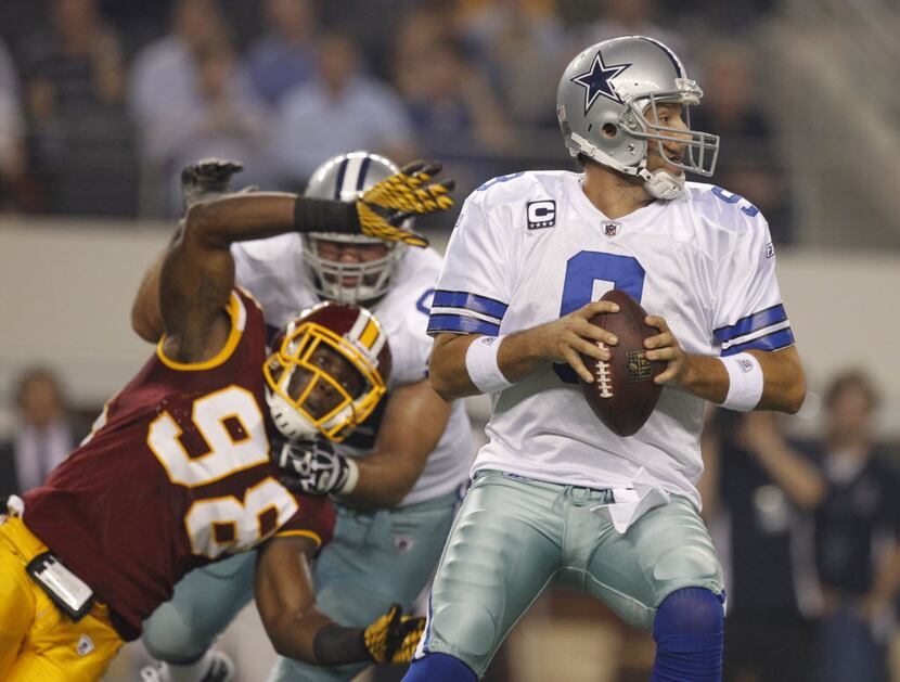 Dallas Cowboys quarterback Tony Romo (9) stands in the pocket as Washington Redskins outside...