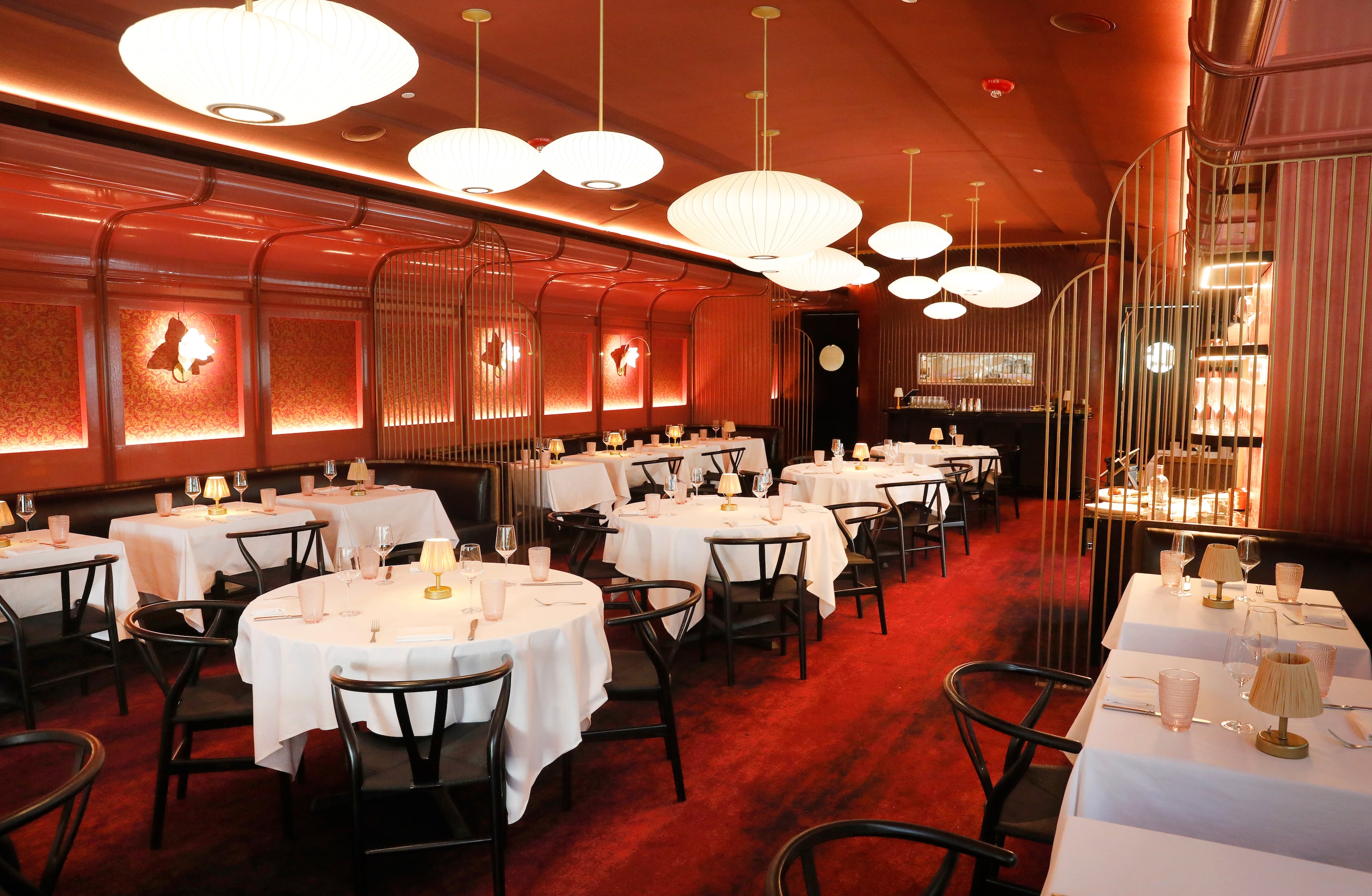 An interior view of the Le PasSage dining room at the super fancy restaurant serving...