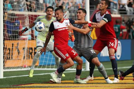 FC Dallas forward Maximiliano Urruti (37) and Minnesota United defender Michael Boxall (15)...