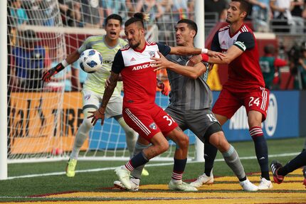 FC Dallas forward Maximiliano Urruti (37) and Minnesota United defender Michael Boxall (15)...