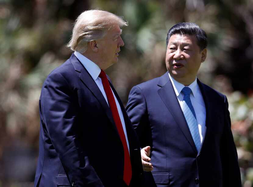 In this April 7 photo, President Trump walks with Chinese President Xi Jinping at...