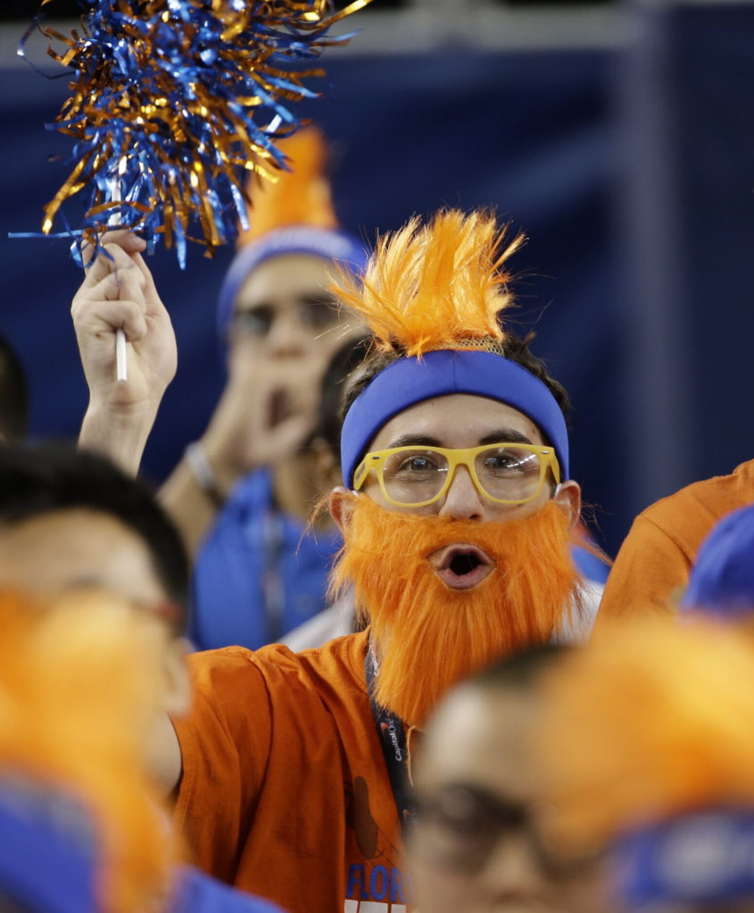 A Florida fan cheers before an NCAA Final Four semifinal game against Connecticut, Saturday,...