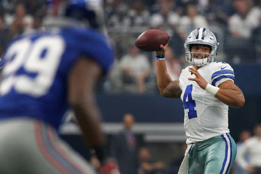 Dallas Cowboys quarterback Dak Prescott (4) looks for a receiver in the first quarter during...