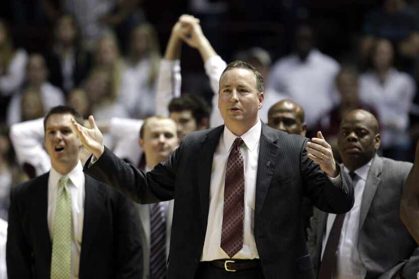 Texas A&M head coach Billy Kennedy, center, reacts after a foul call against his team during...