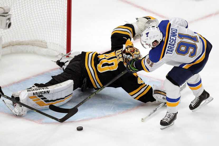 Boston Bruins goaltender Tuukka Rask (40), of Finland, makes a save against St. Louis Blues'...