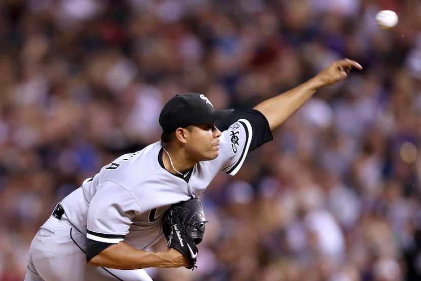 DENVER, CO - JULY 08:  Starting pitcher Jose Quintana #62 of the Chicago White Sox throws ...