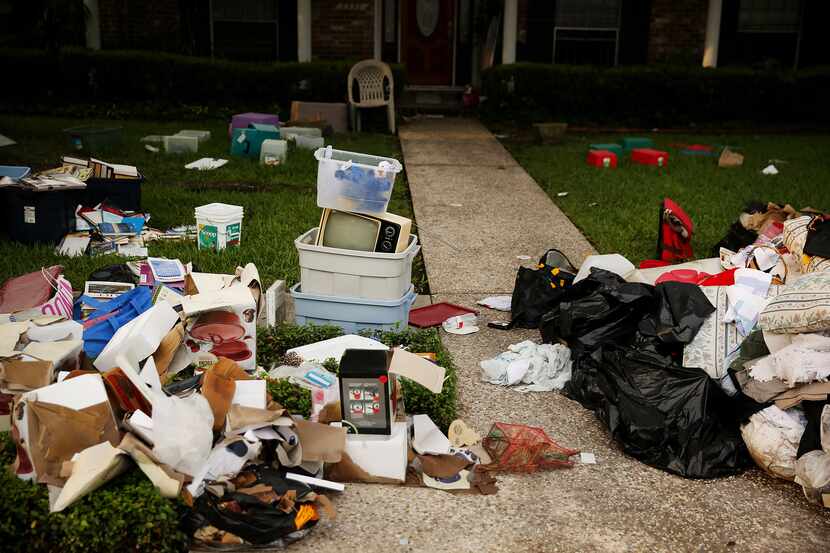 Debris remained outside homes in Meyerland a week after Harvey moved through the area....