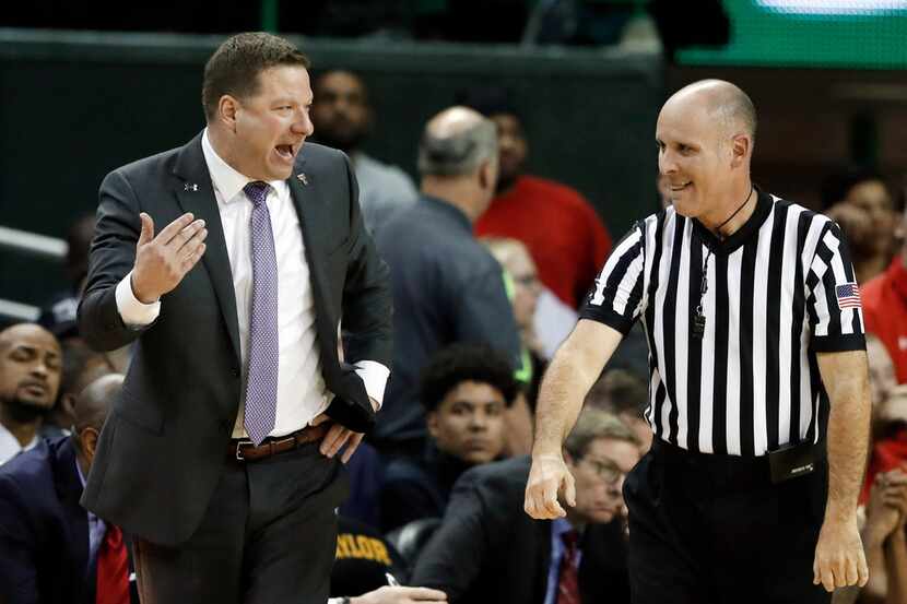 Texas Tech coach Chris Beard, left, argues with an official after a foul call in a 73-62...