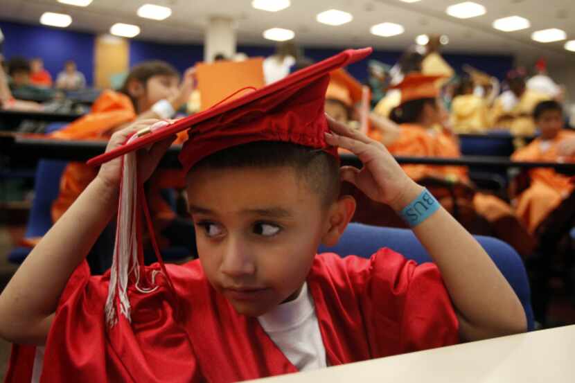 Julian put on his cap for the Rainbow Days program's Kids University graduation at UT-Dallas...
