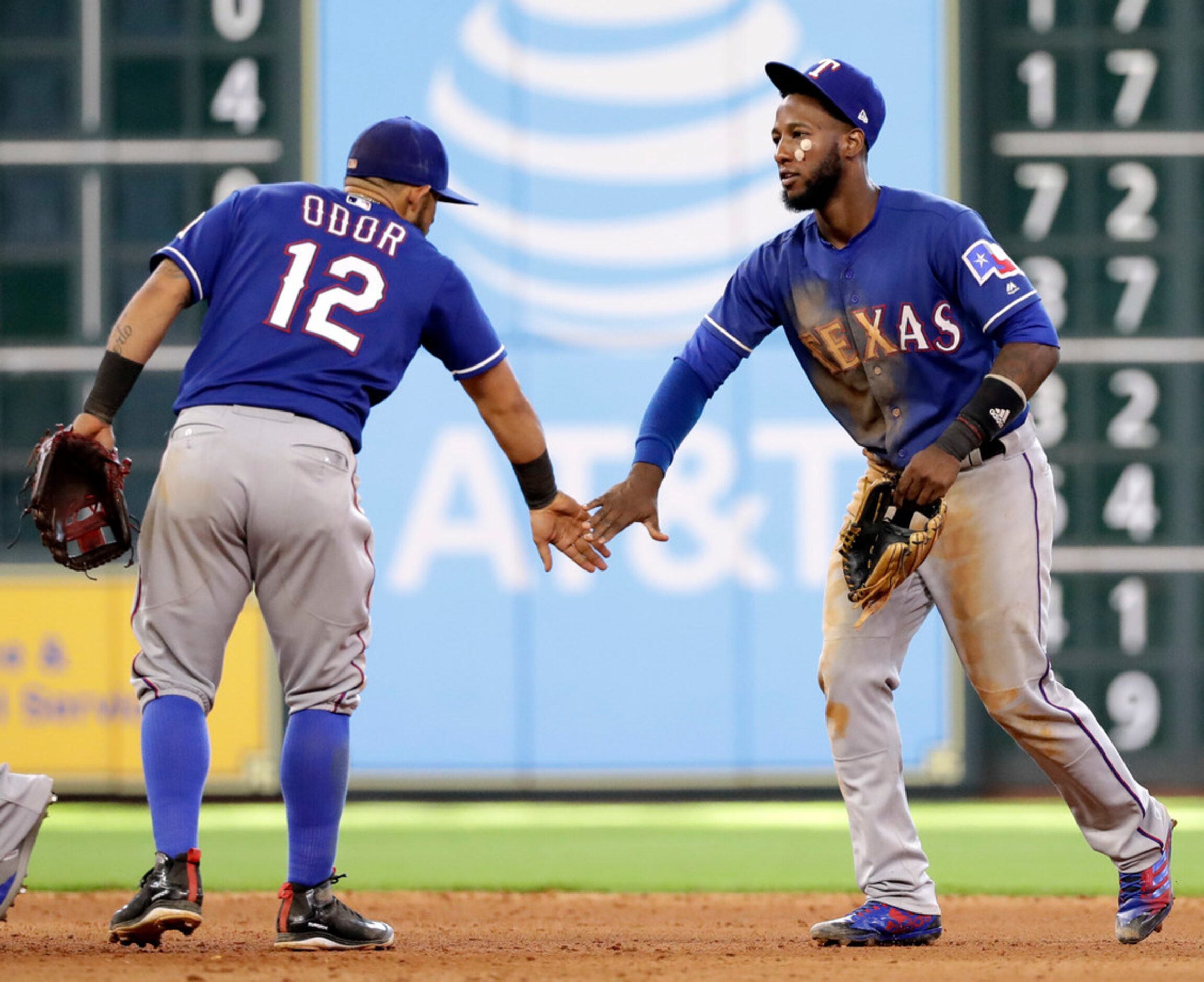 Texas Rangers' Rougned Odor (12) and Jurickson Profar celebrate after a baseball game...