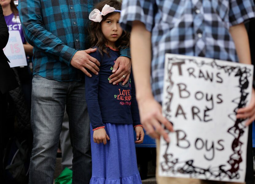 Libby Gonzales stands with her father, Frank Gonzales, as she joins other members of the...