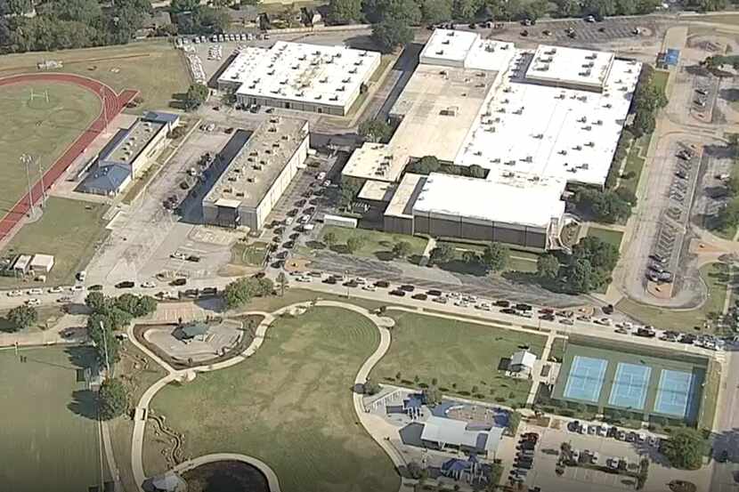 An aerial view from KXAS-TV (NBC 5) shows the line Friday at Mansfield ISD's electronic...
