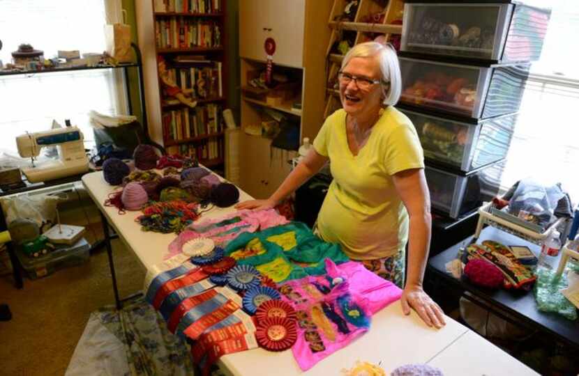 
Ann Gaspari displays her ribbons her craft room at her home in East Dallas. Gaspari began...