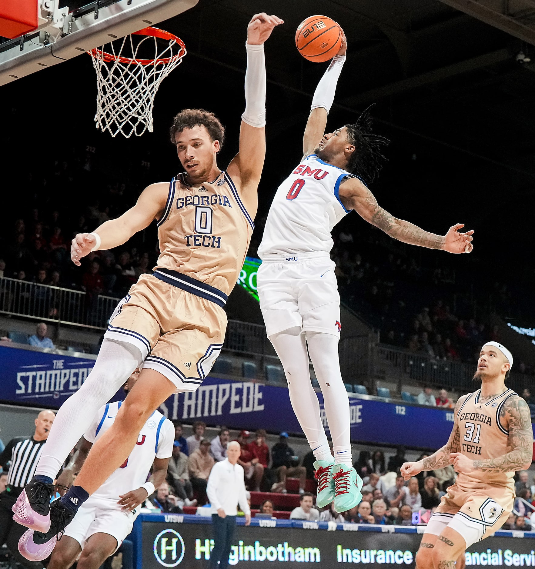 SMU guard B.J. Edwards dunks the ball over Georgia Tech guard Lance Terry during the second...