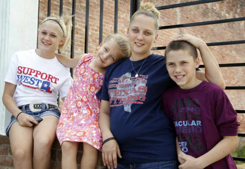 Amanda Atkins, with kids (from left) Celsie Chadwick, Justice Atkins and Caleb Chadwick,...