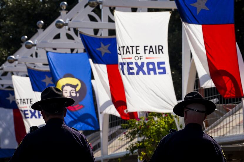 Mounted Dallas police officers patrol the State Fair of Texas.