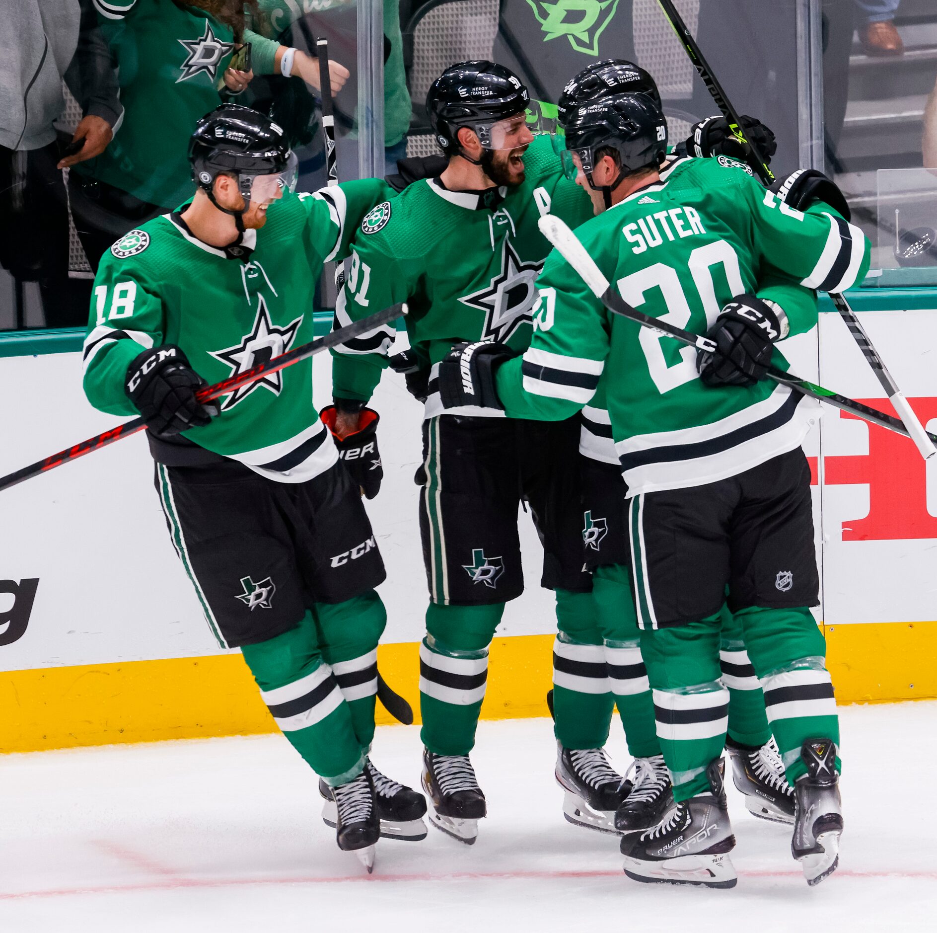 Dallas Stars right wing Denis Gurianov (34) teammates after hitting the game winning puck...