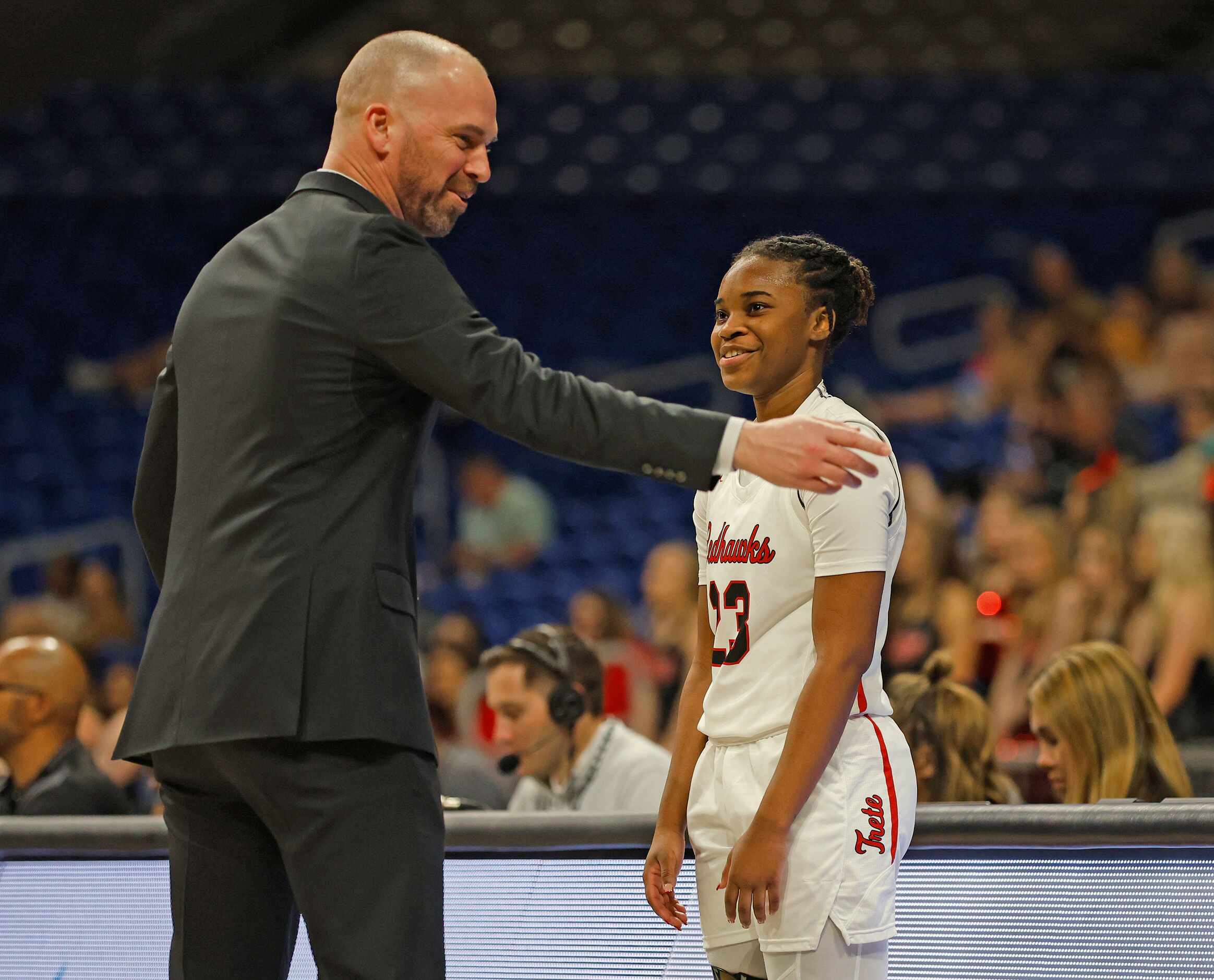 Frisco Liberty head coach Ross Reedy has the attention of Journee Harris (23) as Frisco...