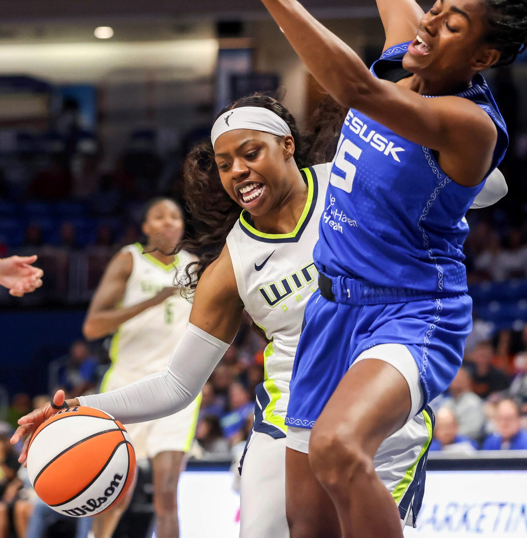 Dallas Wings guard Arike Ogunbowale (24) drives toward the basket against Connecticut Sun...