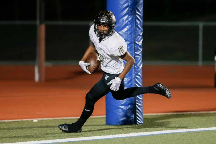 The Colony junior running back Myles Price (2) scores a touchdown during the first half of a...