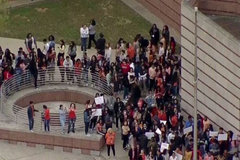 Students walk out of Townview Magnet Center to protest gun violence.