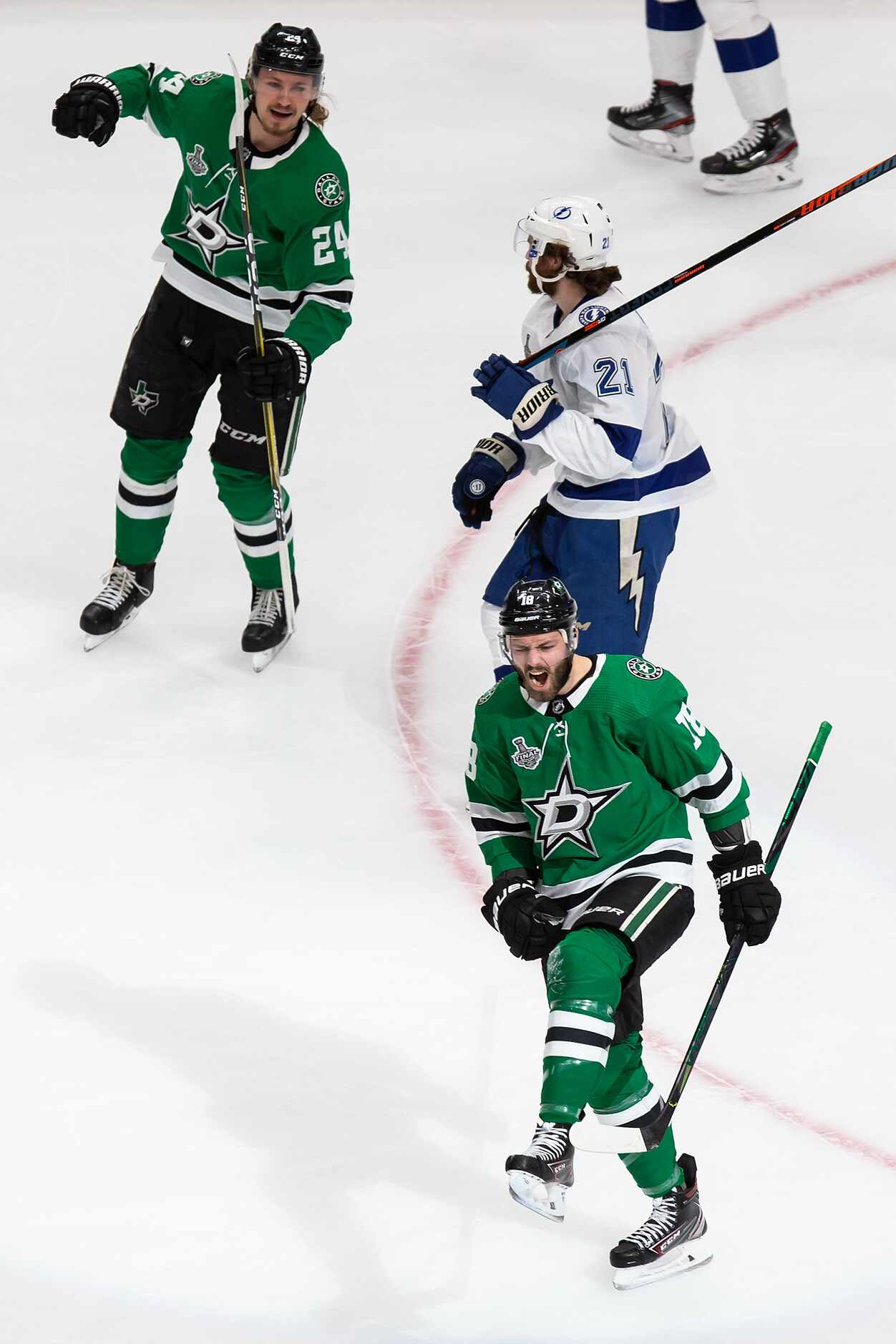 Roope Hintz (24) and Jason Dickinson (18) of the Dallas Stars celebrate Dickinson's goal...