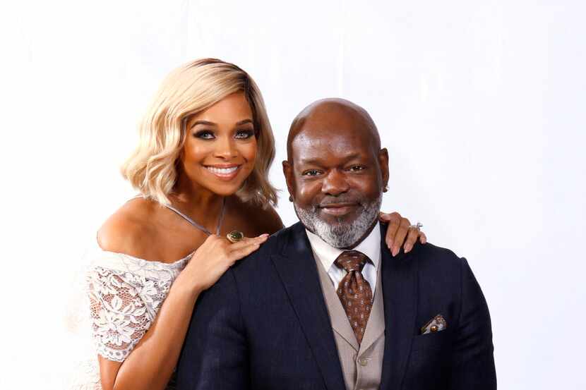 Former Dallas Cowboys running back Emmitt Smith poses with his wife Pat in their home in...