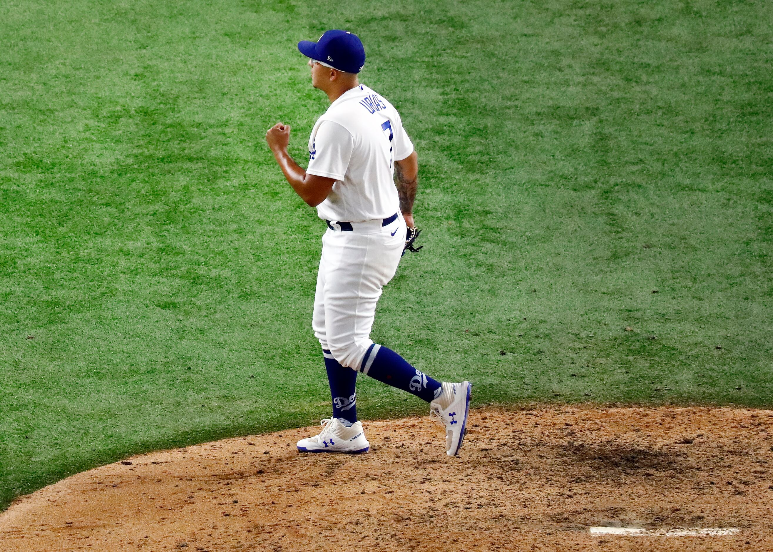 Los Angeles Dodgers relief pitcher Julio Urias (7) reacts after striking out Tampa Bay Rays...